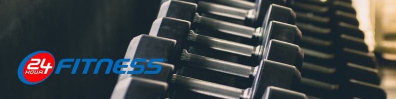 Close-up of dumbbells on a rack at 24 Hour Fitness, highlighting gym facilities ideal for travelers wanting to stay fit.