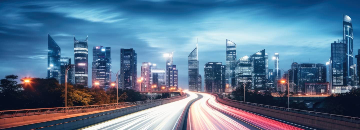 A futuristic city at night with light trails from fast vehicles, highlighting urban energy for travelers seeking active stays.