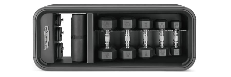 A tidy fitness storage unit with dumbbells, weight plates, and a foam roller to help guests stay active while traveling.